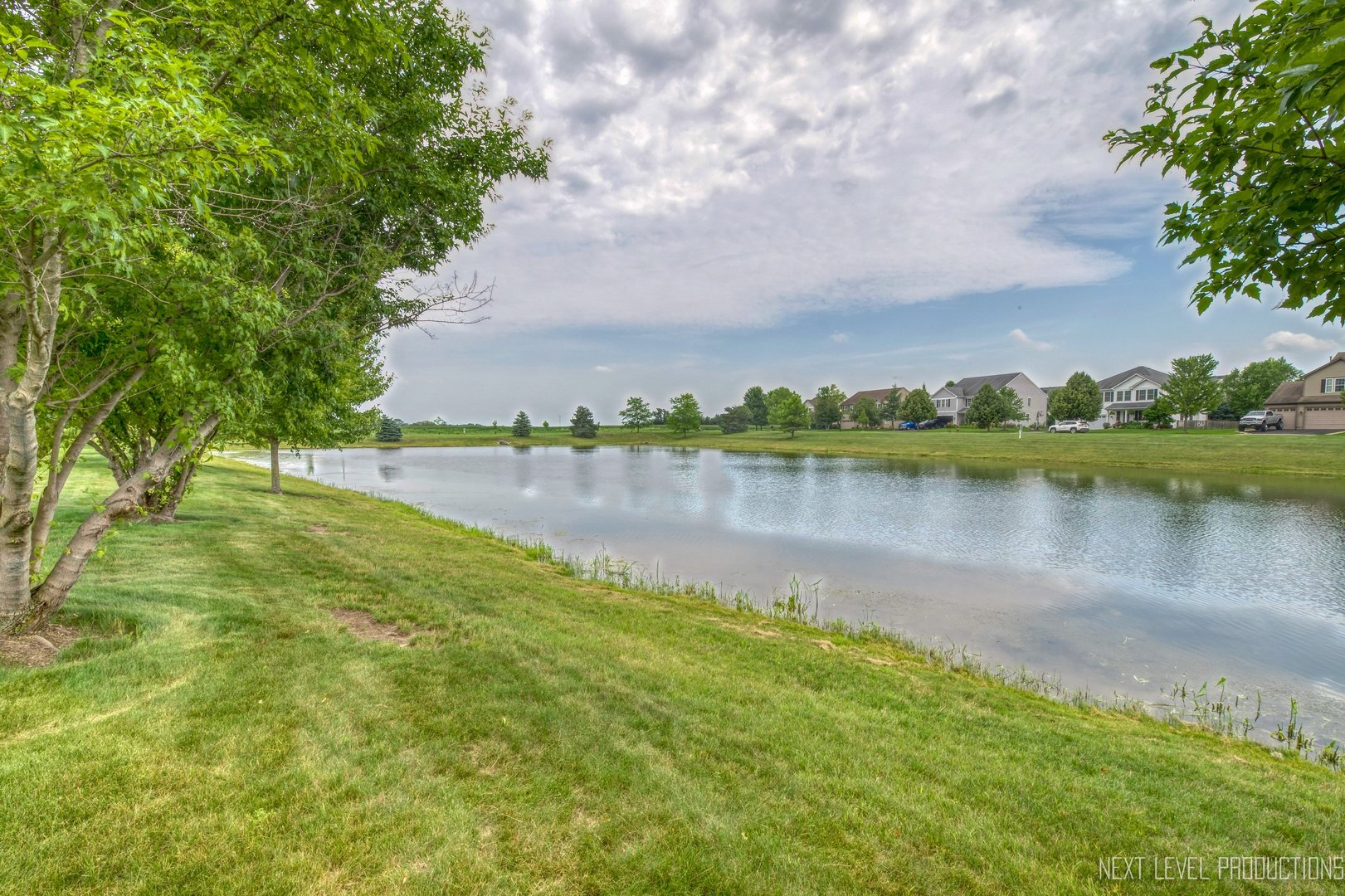 1147 Freedom Road Elburn, IL 60119 - Photo 21 of 21 a view of a lake with houses in the back