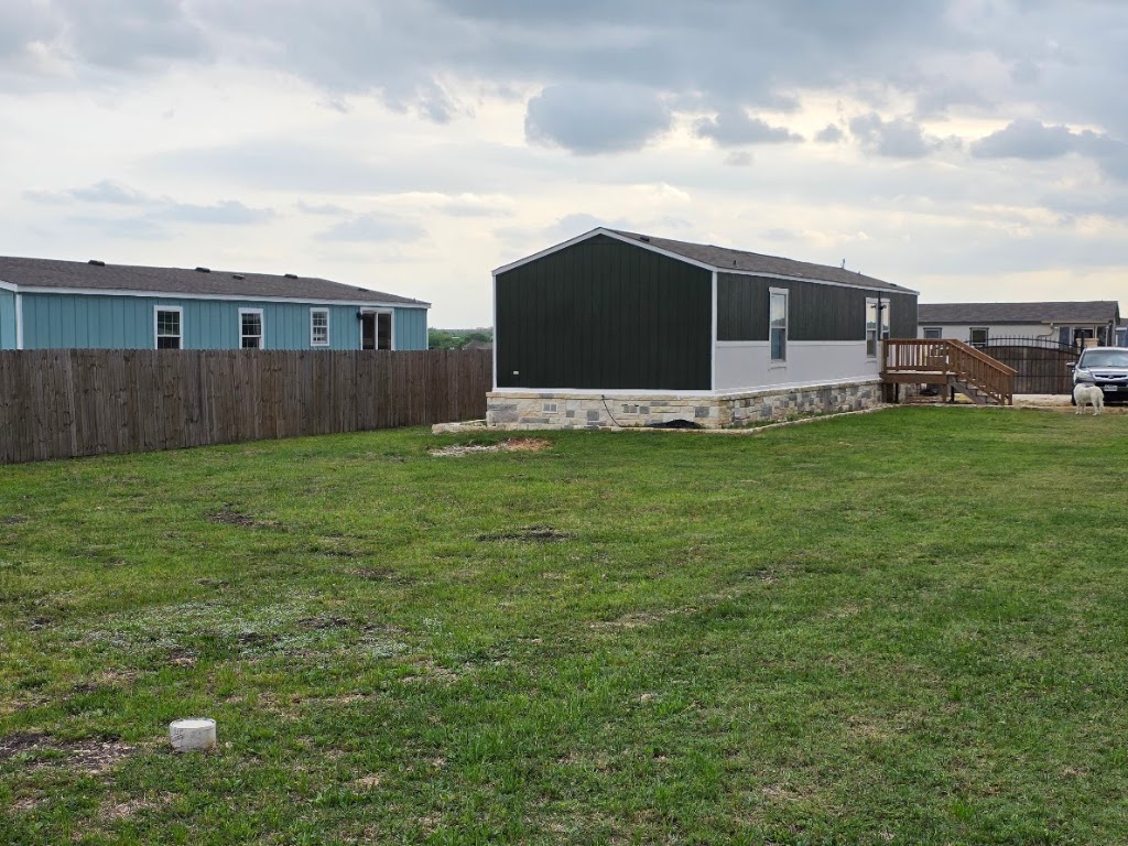 1100 Rustler Pass Kyle, TX 78640 - Photo 2 of 14 a view of a backyard