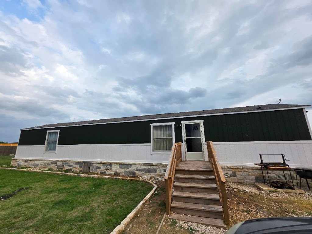 1100 Rustler Pass Kyle, TX 78640 - Photo 4 of 14 a front view of a house with a yard