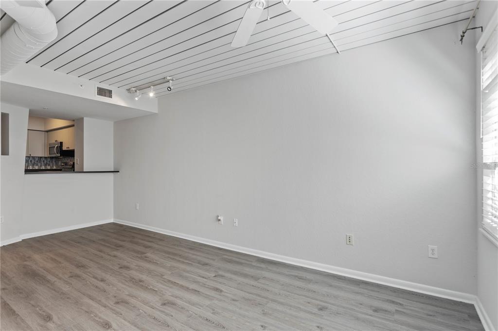 2411 West Horatio Street, Unit 522 Tampa, FL 33609 - Photo 13 of 21 a view of a room with wooden floor and white walls