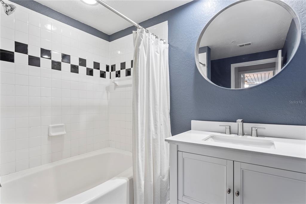 2411 West Horatio Street, Unit 522 Tampa, FL 33609 - Photo 15 of 21 a bathroom with a sink and a mirror