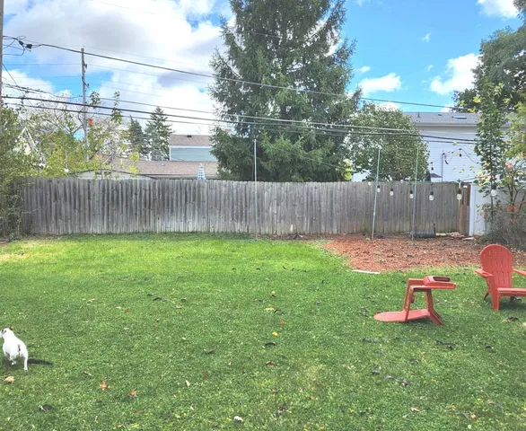 a backyard of a house with lots of green space