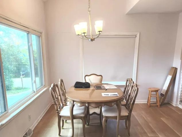 a view of a dining room with furniture window and outside view