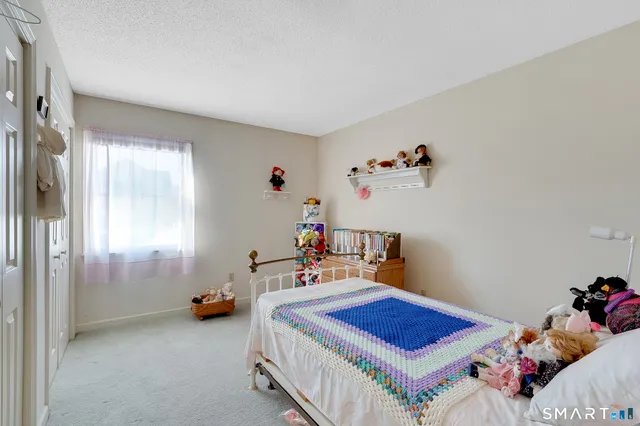 a bed room with a bed and a table