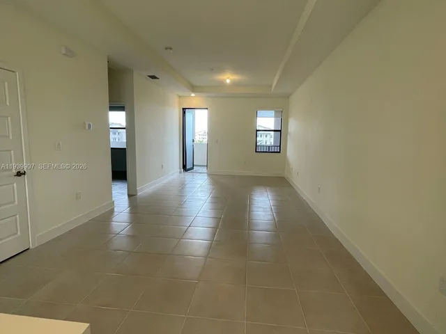 a view of an empty room and window