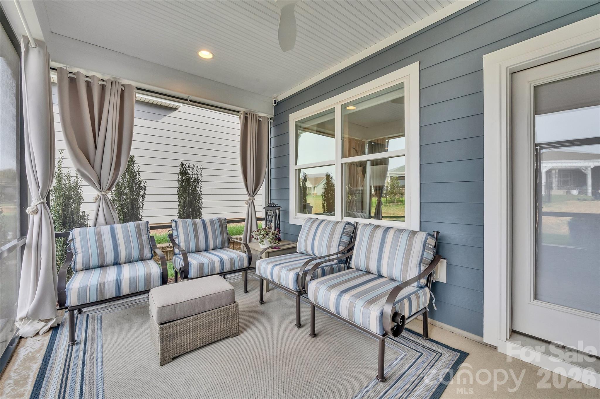 6243 Scuttle Lane Denver, NC 28037 - Photo 23 of 34 a living room with furniture and a large window