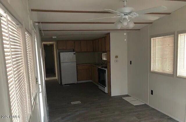 2451 West Cholla Street Apache Junction, AZ 85120 - Photo 14 of 14 wooden floor in an empty room with a kitchen