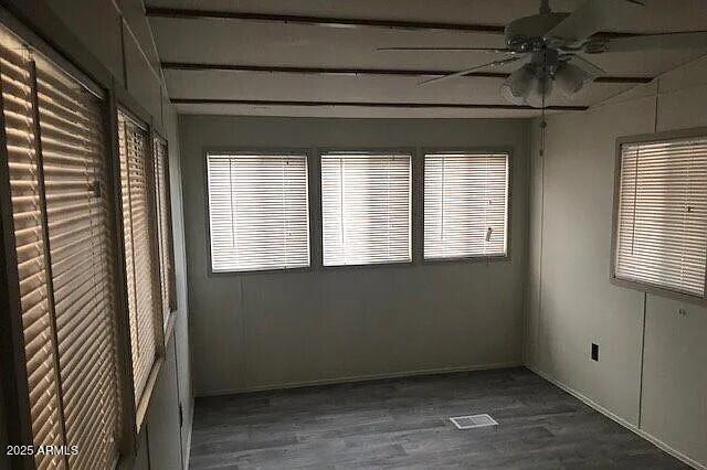 2451 West Cholla Street Apache Junction, AZ 85120 - Photo 4 of 14 a view of an empty room with a window