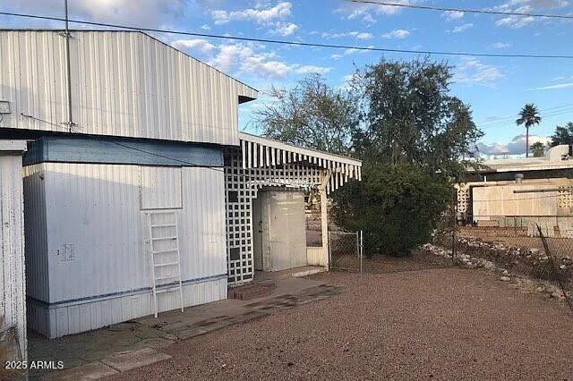 2451 West Cholla Street Apache Junction, AZ 85120 - Photo 6 of 14 a view of a house with a garage