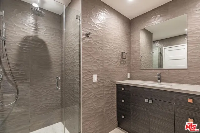 a bathroom with a double vanity sink and mirror