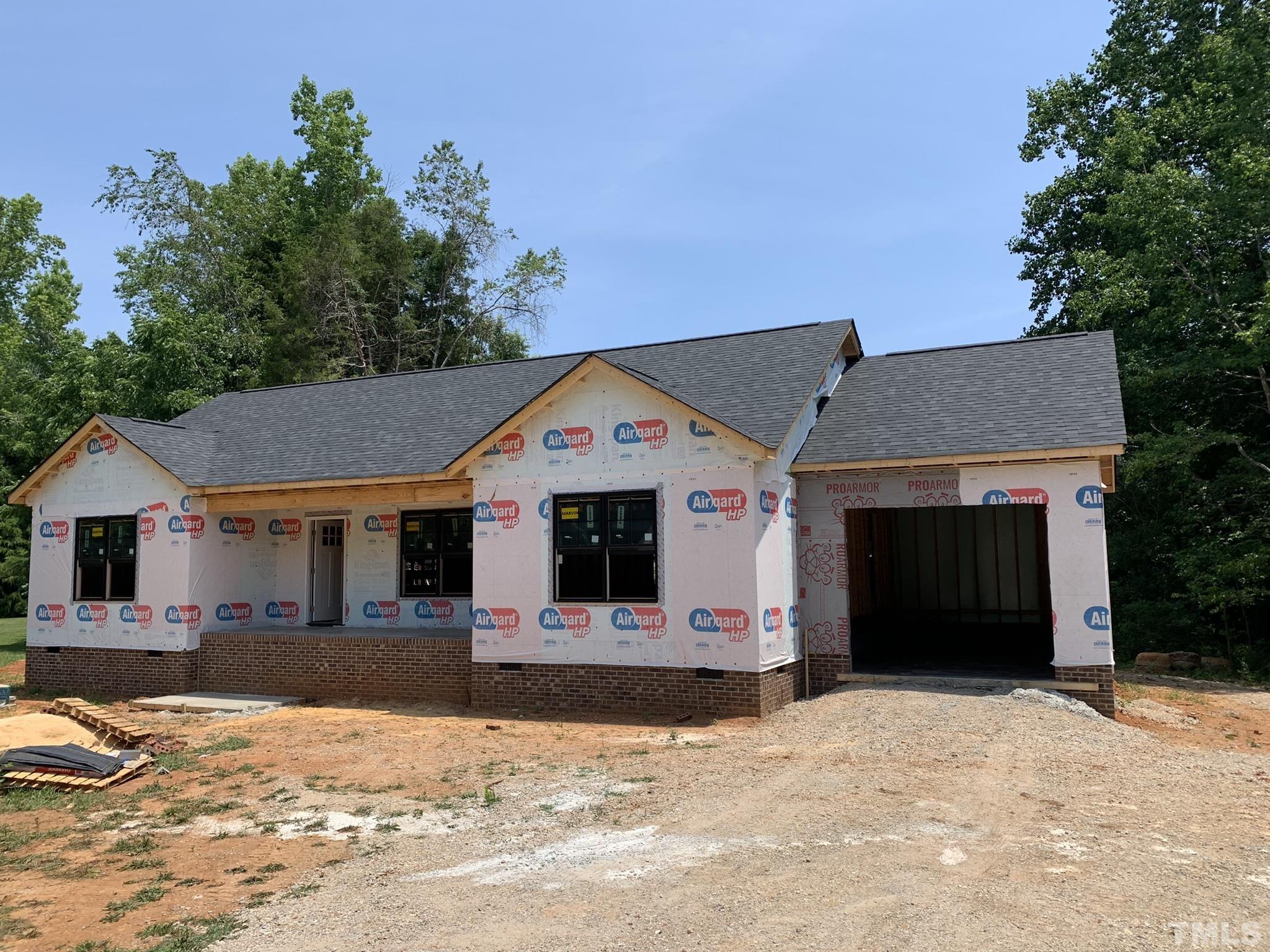 9503 Meredith Drive Rougemont, NC 27572 - Photo 3 of 15 a front view of a house with a yard