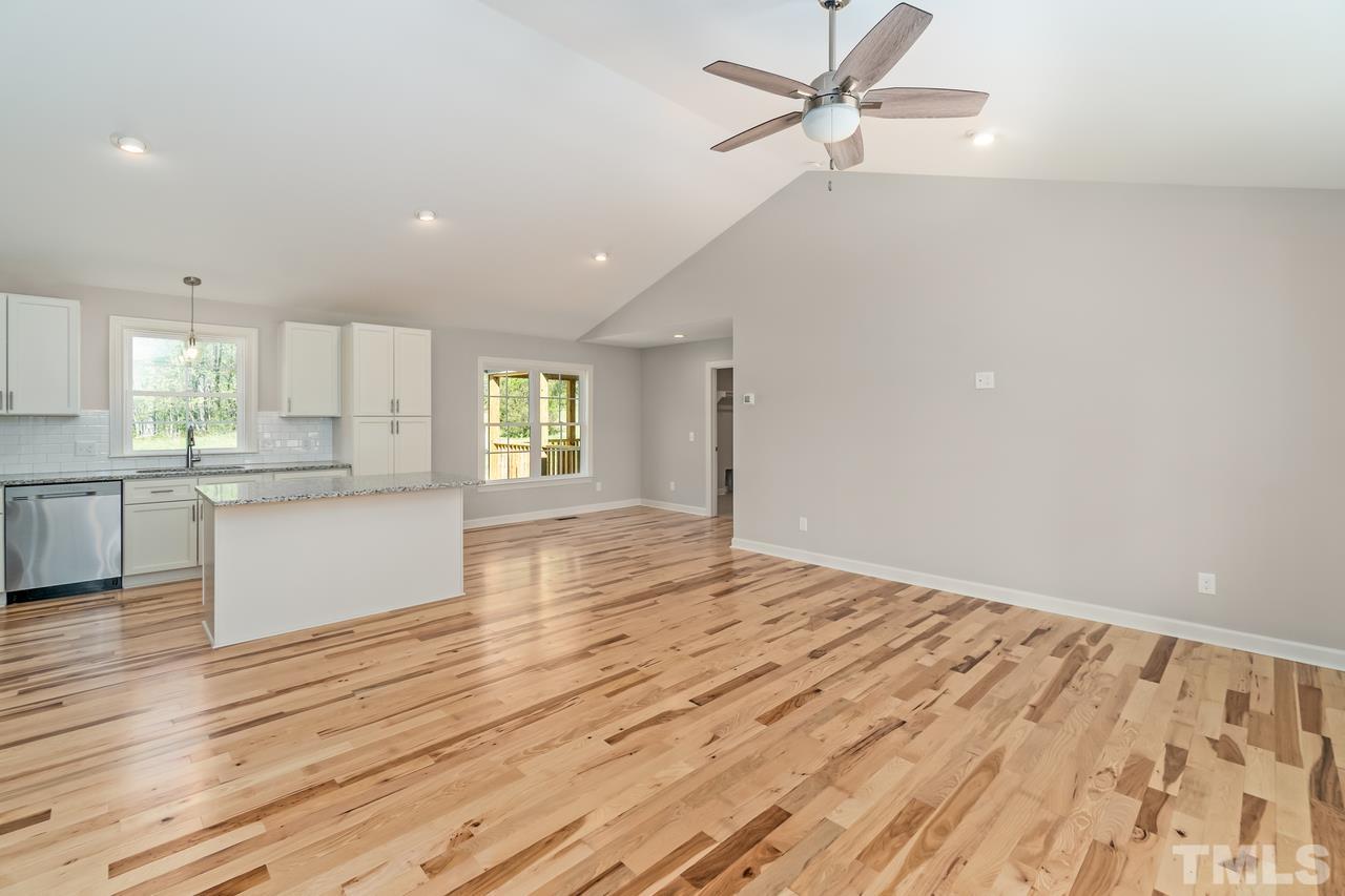 9503 Meredith Drive Rougemont, NC 27572 - Photo 9 of 15 a view of an empty room with window and wooden floor