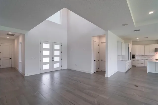 an open kitchen with a table and chairs in it