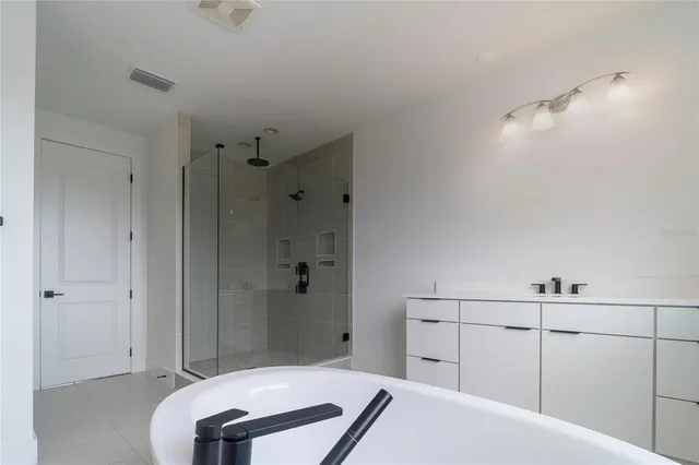 a bathroom with a sink and vanity