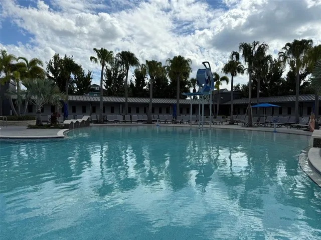 a view of a swimming pool with a patio