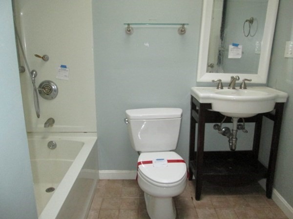 80 Murphy Road Hudson, MA 01749 - Photo 13 of 24 a bathroom with a sink a toilet and shower