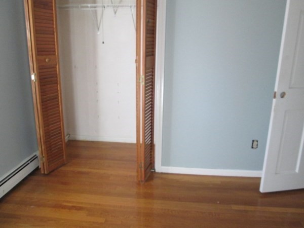 80 Murphy Road Hudson, MA 01749 - Photo 19 of 24 a view of an empty room with wooden floor and a window