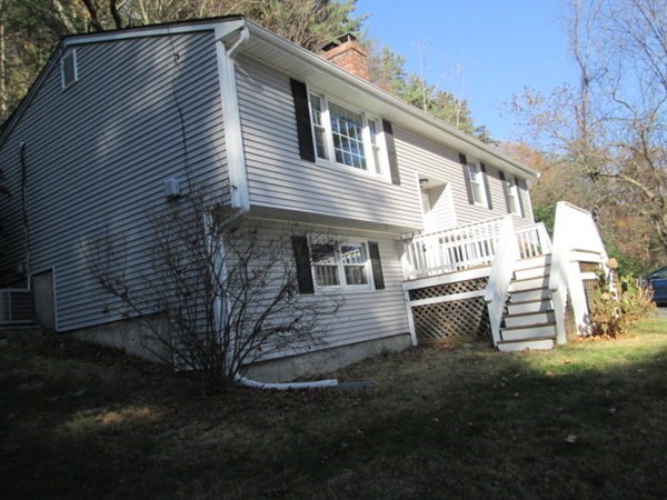 80 Murphy Road Hudson, MA 01749 - Photo 2 of 24 a front view of house with a garden