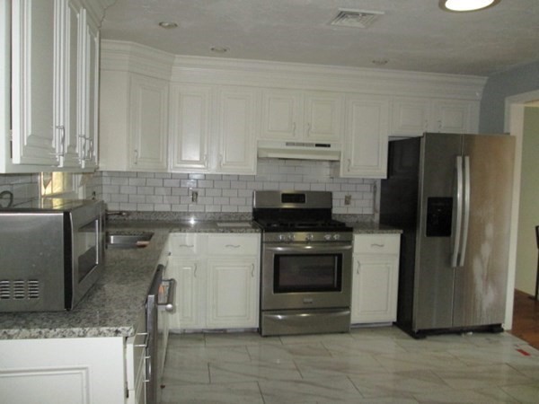 80 Murphy Road Hudson, MA 01749 - Photo 6 of 24 a kitchen with a refrigerator sink and stove
