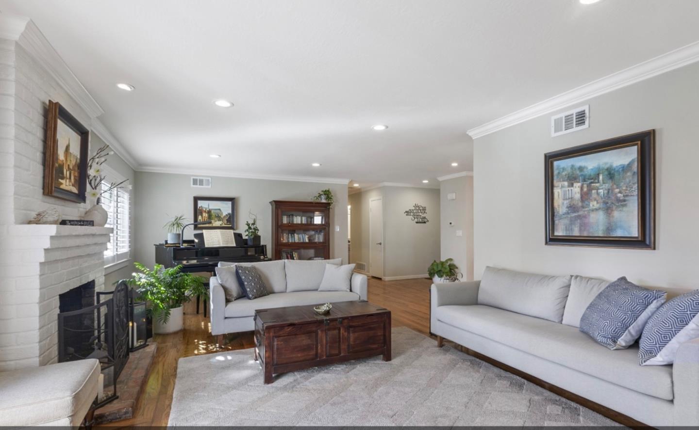 1470 Ridgeley Drive Campbell, CA 95008 - Photo 6 of 12 a living room with furniture fireplace and a potted plant