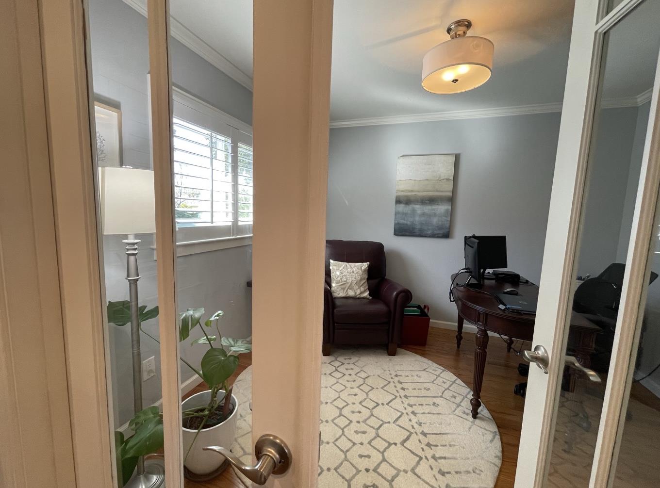 1470 Ridgeley Drive Campbell, CA 95008 - Photo 8 of 12 a living room with furniture and a gate