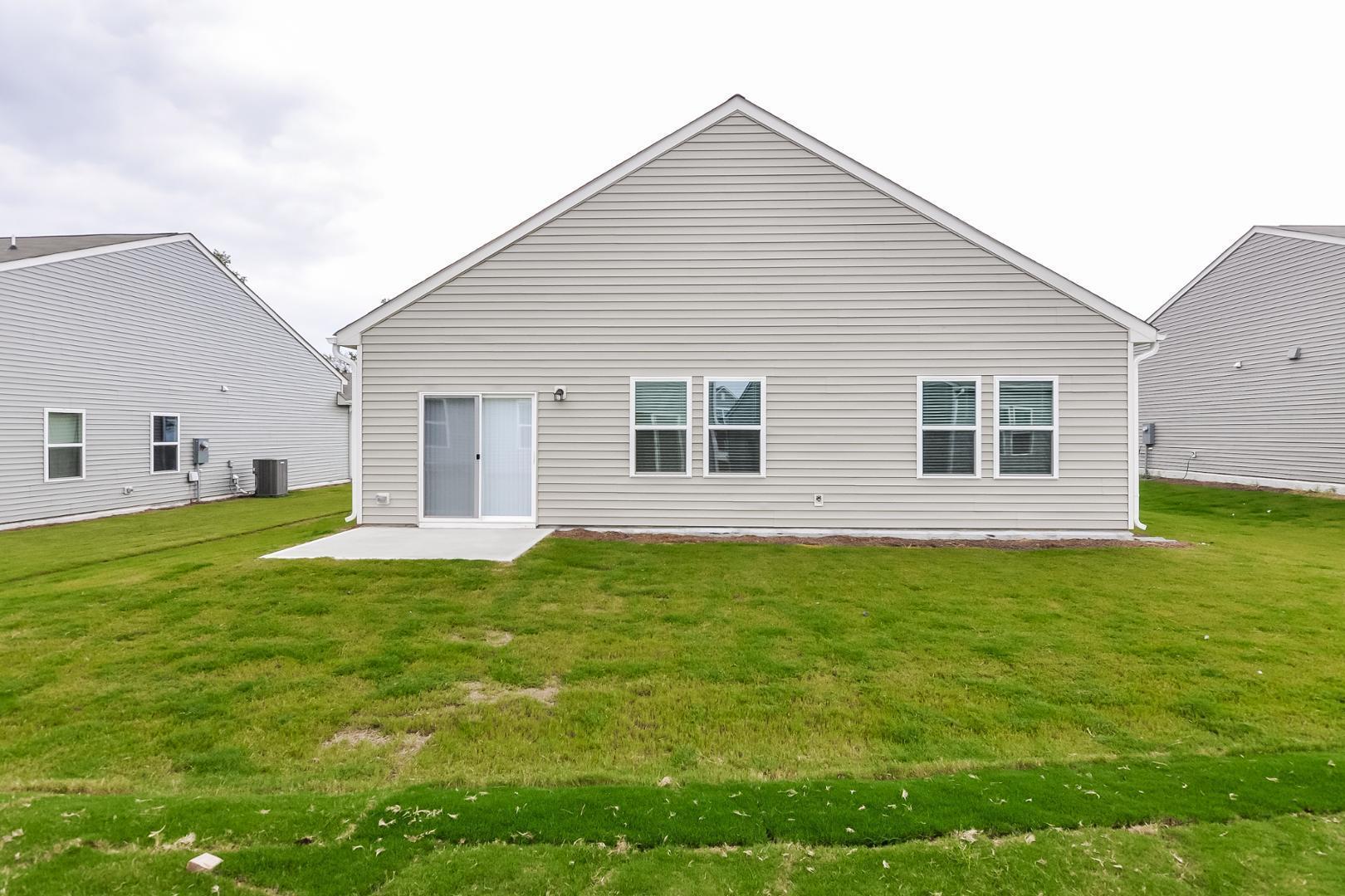 709 Kenyon Spring Drive Zebulon, NC 27597 - Photo 15 of 18 a house view with a garden space