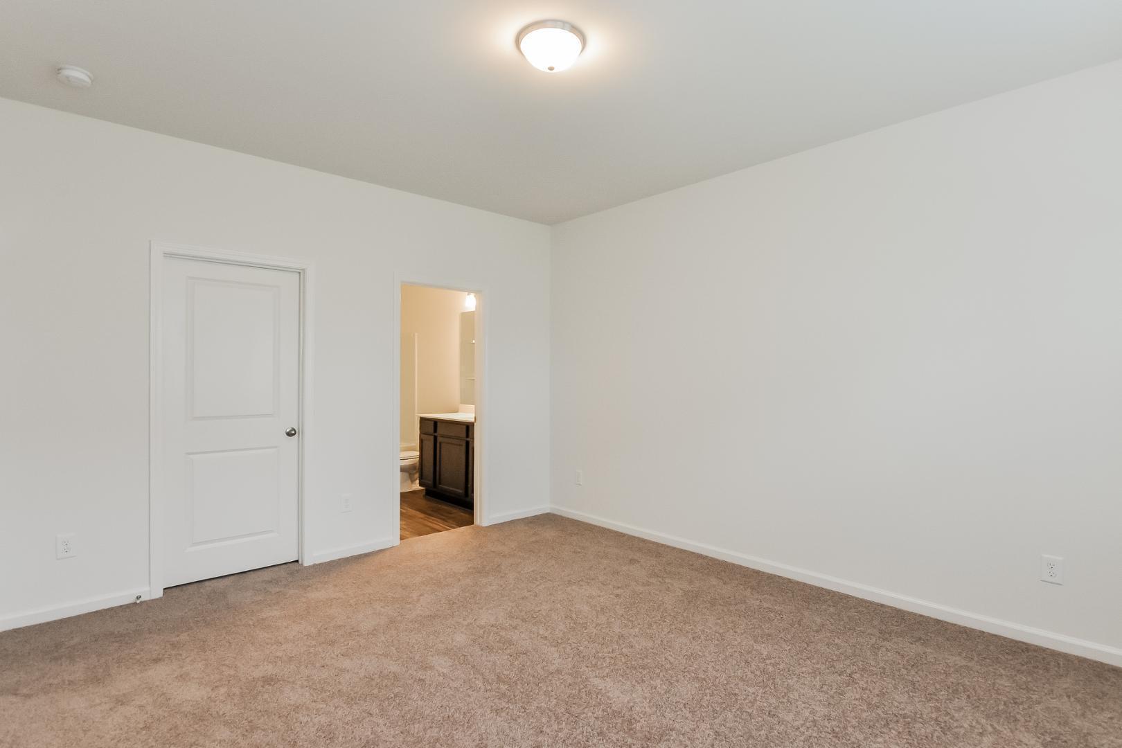 709 Kenyon Spring Drive Zebulon, NC 27597 - Photo 8 of 18 a view of an empty room