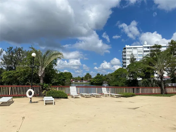 a view of swimming pool with a patio and a yard