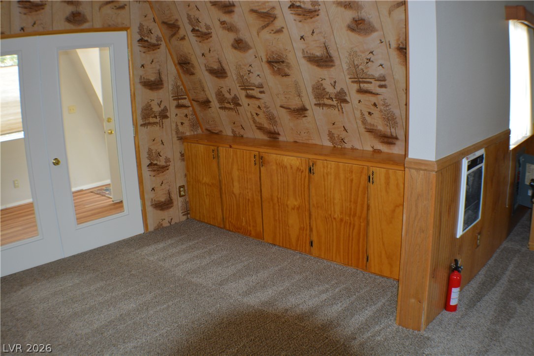 1321 Trout Canyon Road Las Vegas, NV 89124 - Photo 28 of 50 Functional built-in storage complements the unique angled ceiling, creating a cozy and efficient area.