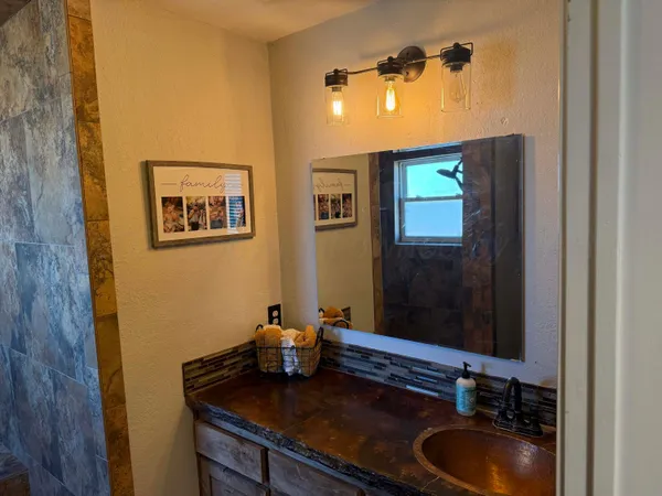 a bathroom with a toilet a sink and bathtub