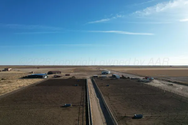 an aerial view of a terrace with lawn chairs
