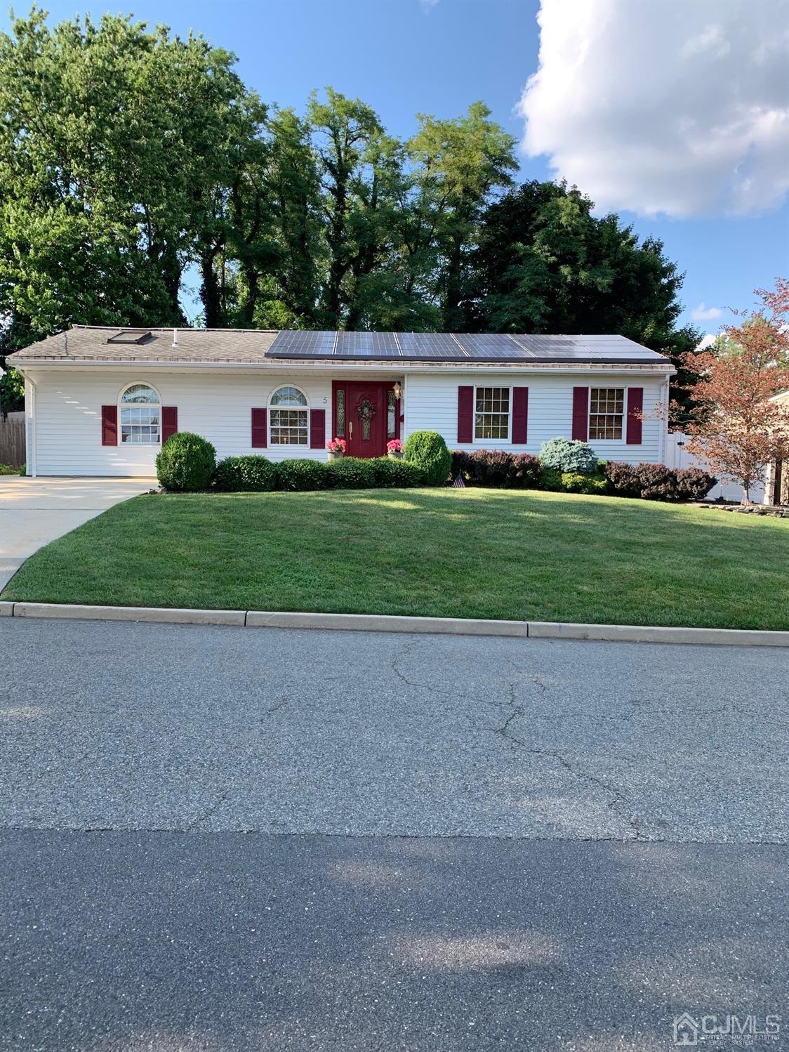 5 Princeton Road Old Bridge, NJ 08859 - Photo 1 of 20 a front view of a house with a yard