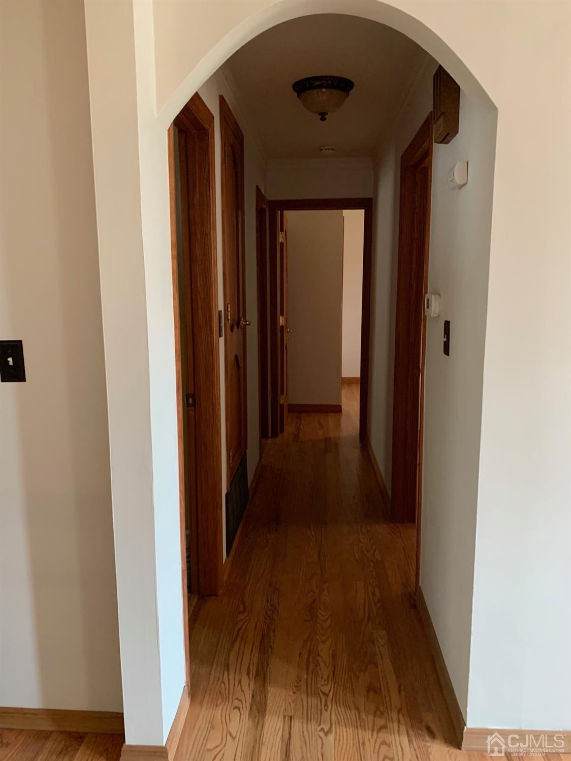 5 Princeton Road Old Bridge, NJ 08859 - Photo 10 of 20 a view of a hallway with wooden floor