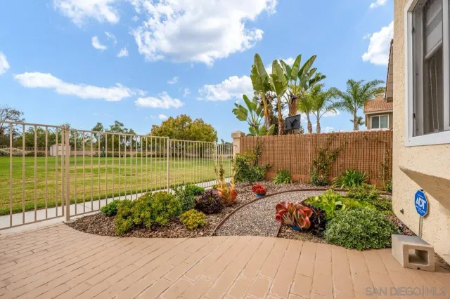a view of a garden with a fountain