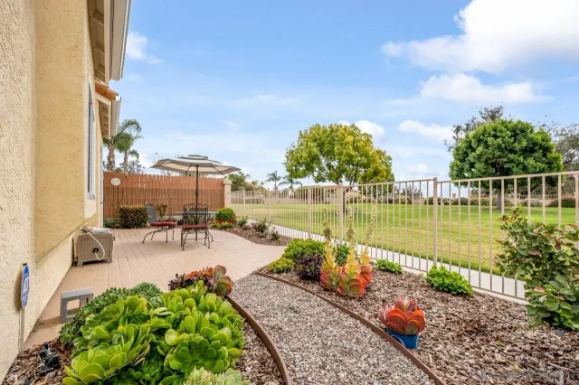 a view of a lake with couches and city view