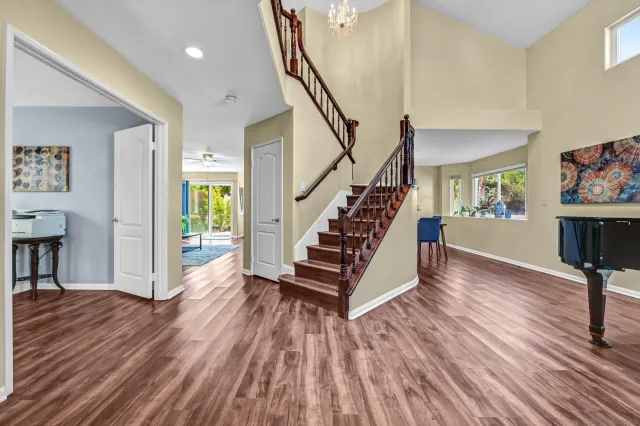 a view of entryway with wooden floor and stairs