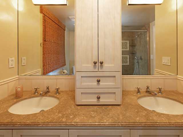 1316 Crest Road Del Mar, CA 92014 - Photo 12 of 25 The master bath has dual vanities, lovely storage cabinetry and beautiful finishes.