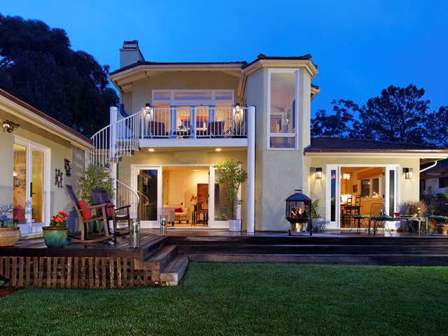 1316 Crest Road Del Mar, CA 92014 - Photo 15 of 25 Large west-facing back yard enjoys tons of light throughout the day, and wonderful Del Mar sunsets! Pictured above is the Master Suite wing with its own access to back yard. Note also the spiral staircase that takes you up to the second level balcony.