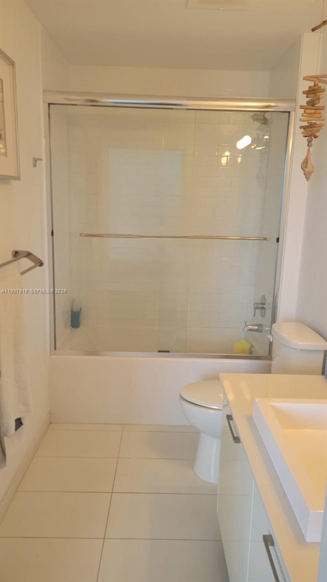 151 Southeast 1st Street, Unit 2507 Miami, FL 33131 - Photo 14 of 34 a bathroom with a shower and a sink