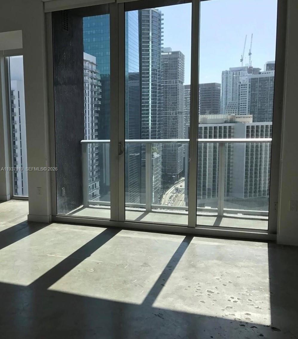 151 Southeast 1st Street, Unit 2507 Miami, FL 33131 - Photo 30 of 34 a view of a living room and bathroom
