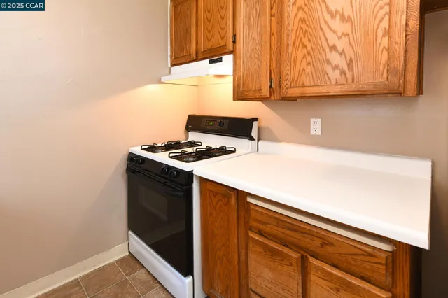 a kitchen with a sink and a window