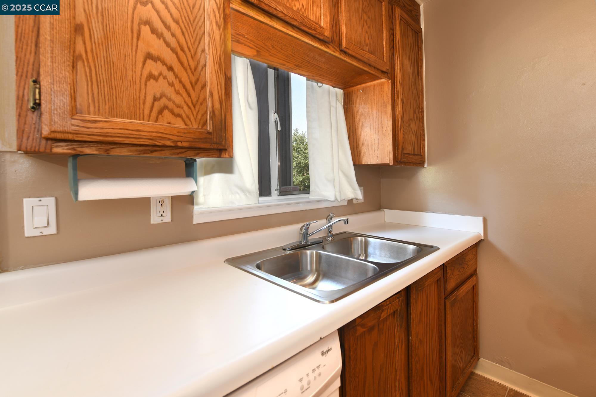 1672 Terrace Road Walnut Creek, CA 94597 - Photo 16 of 38 a kitchen with a sink and a window