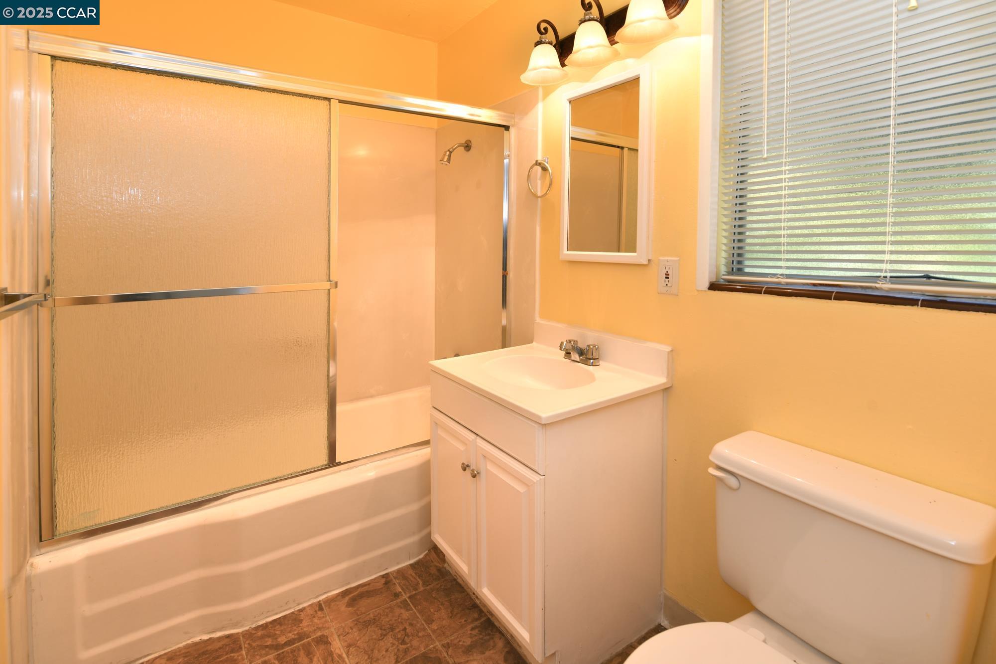 1672 Terrace Road Walnut Creek, CA 94597 - Photo 18 of 38 a bathroom with a sink a toilet and shower