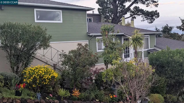 a backyard of a house with lots of green space