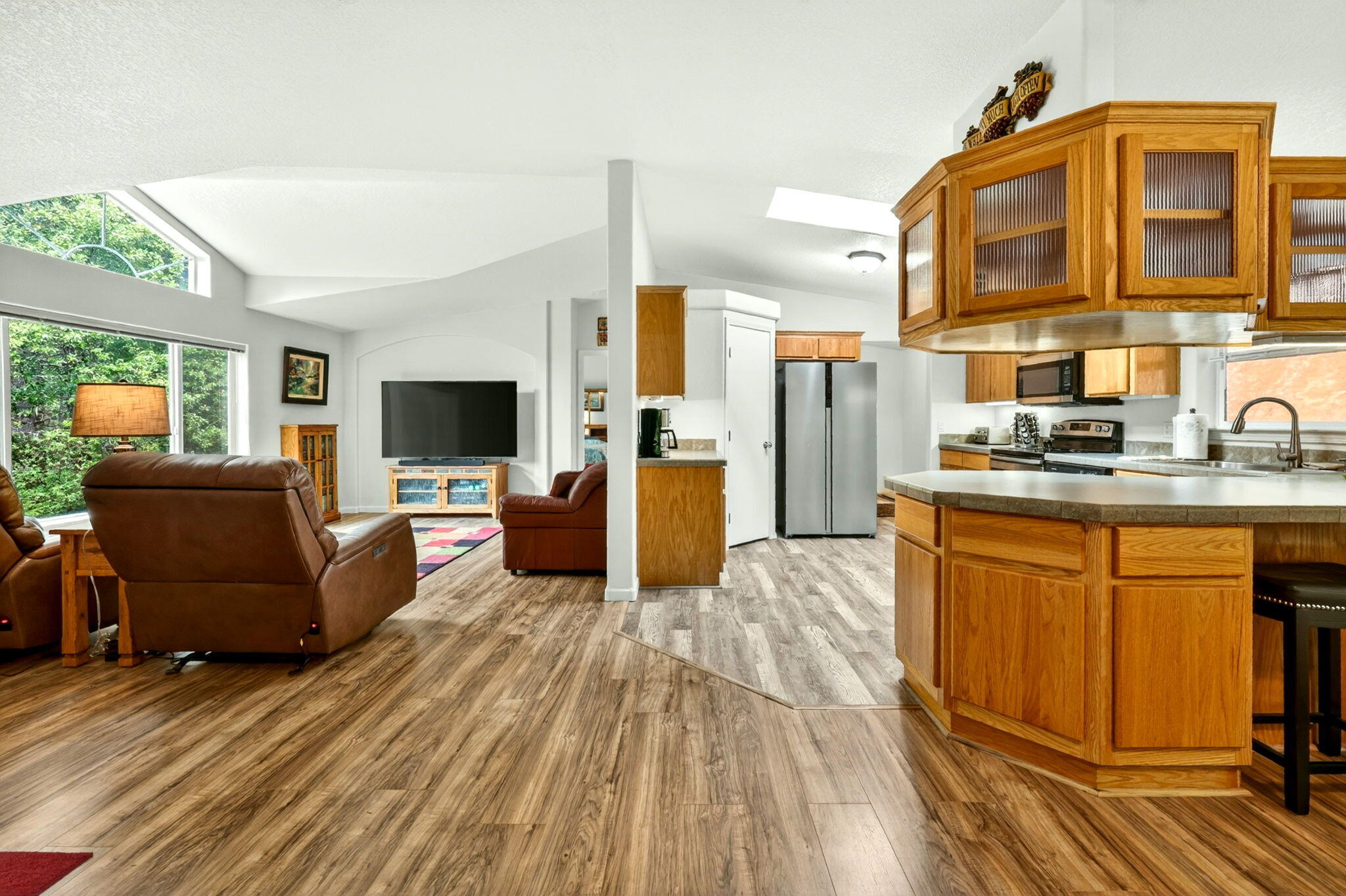 5445 Thompson Creek Road Selma, OR 97538 - Photo 12 of 57 a living room with stainless steel appliances kitchen island granite countertop furniture and a flat screen tv
