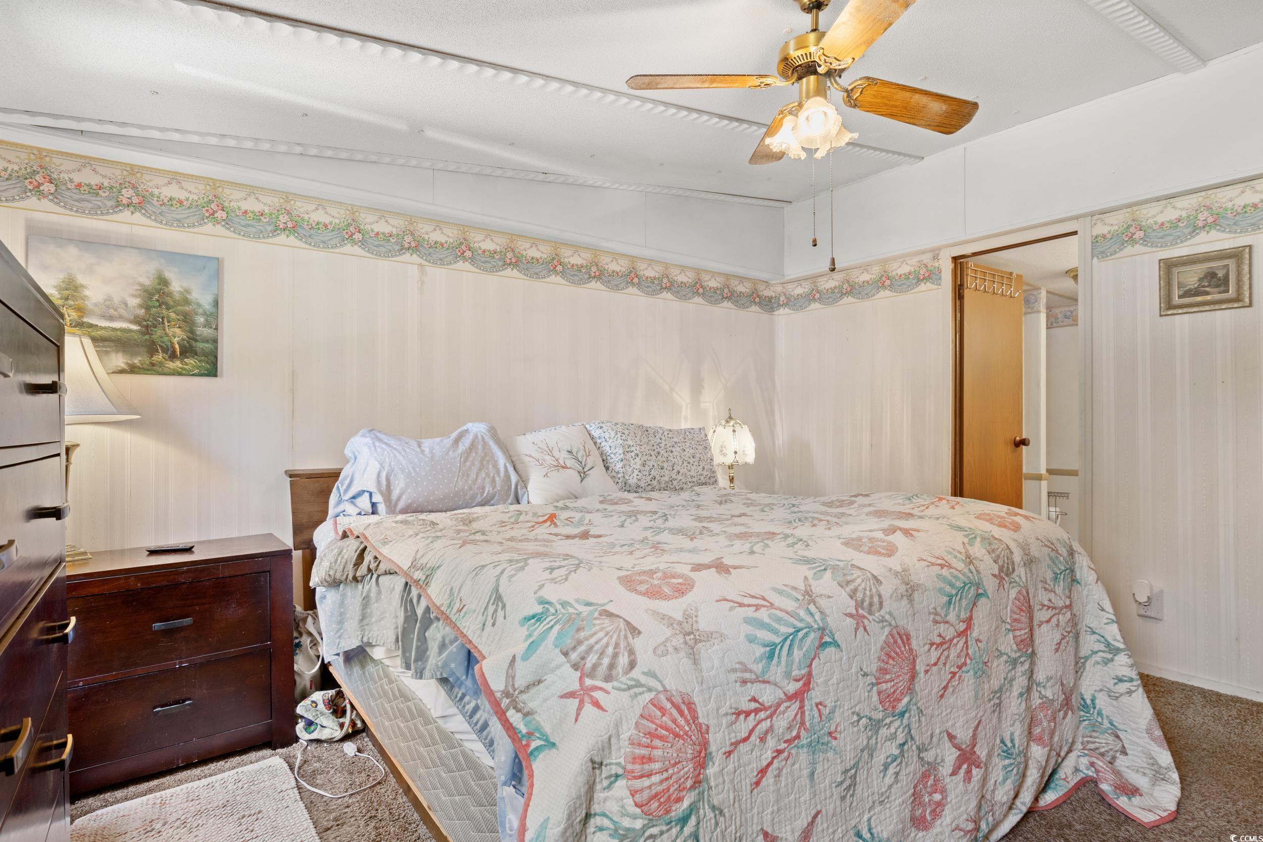 563 Plum Court Myrtle Beach, SC 29579 - Photo 24 of 34 Bedroom featuring carpet floors and a ceiling fan