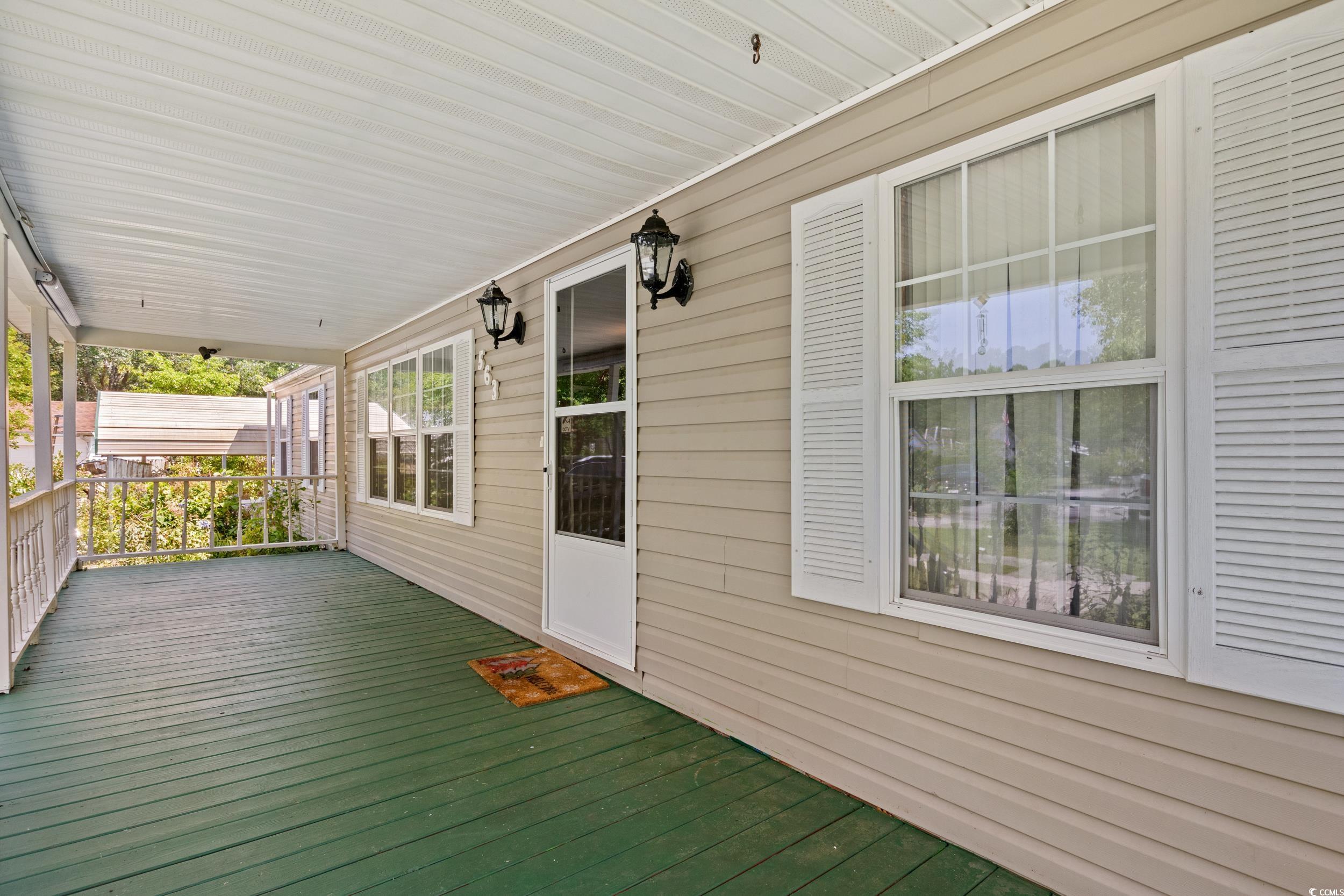563 Plum Court Myrtle Beach, SC 29579 - Photo 3 of 34 Deck with covered porch