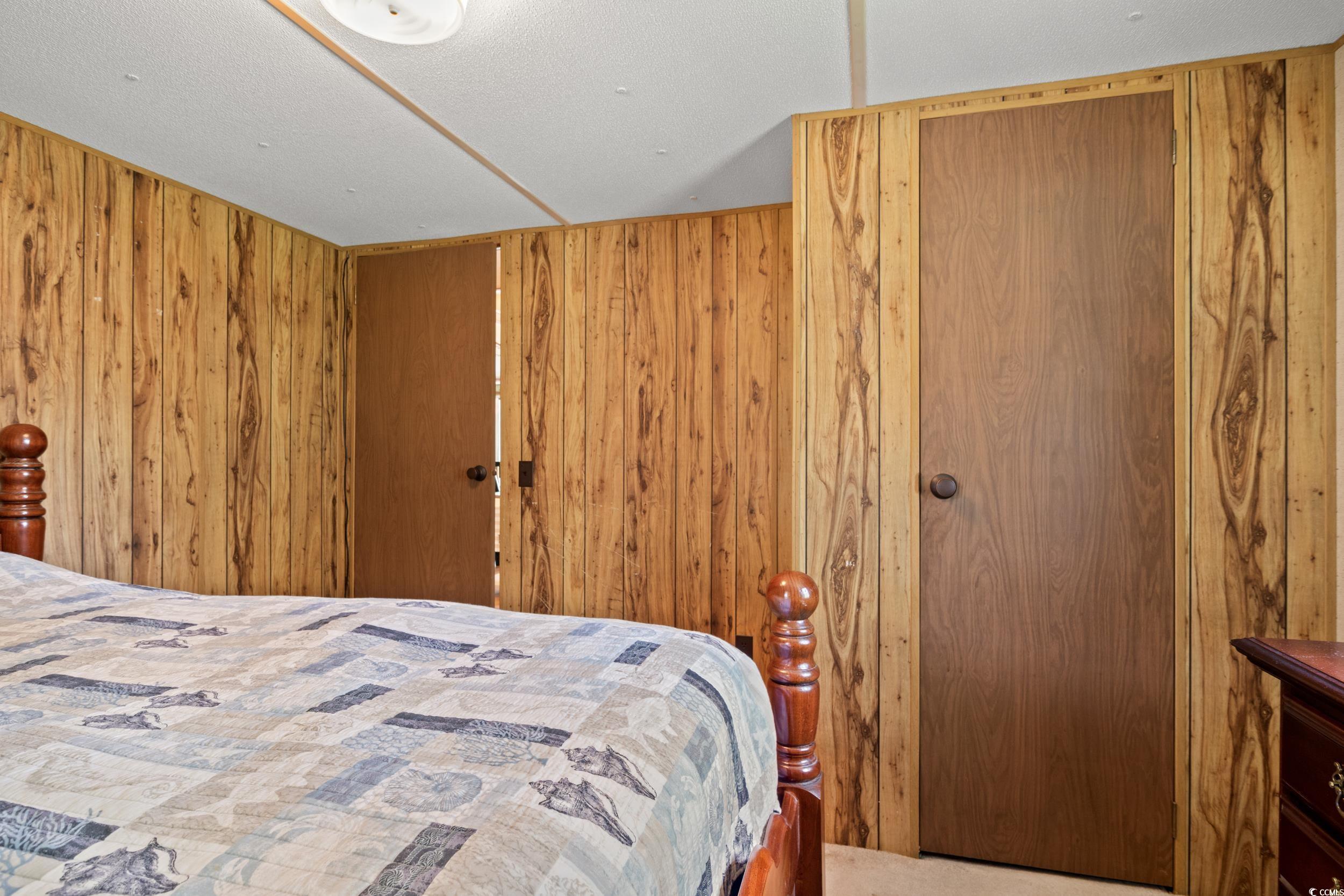 563 Plum Court Myrtle Beach, SC 29579 - Photo 6 of 34 Bedroom with wooden walls