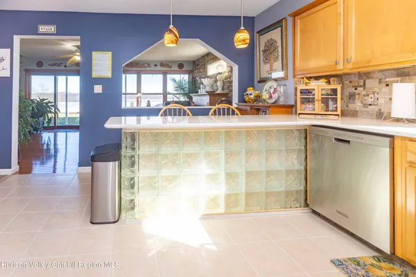 a view of a kitchen with a sink and a window