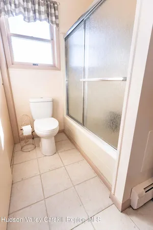 a bathroom with a sink mirror and a vanity